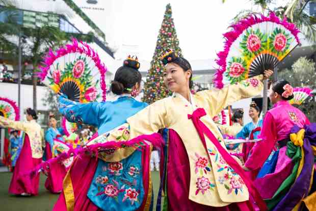 PAVA World Korean Traditional Band and fan dancers perform during...