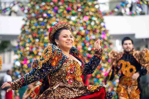 Caporales San Simón Group performs a traditional Bolivian dance during...