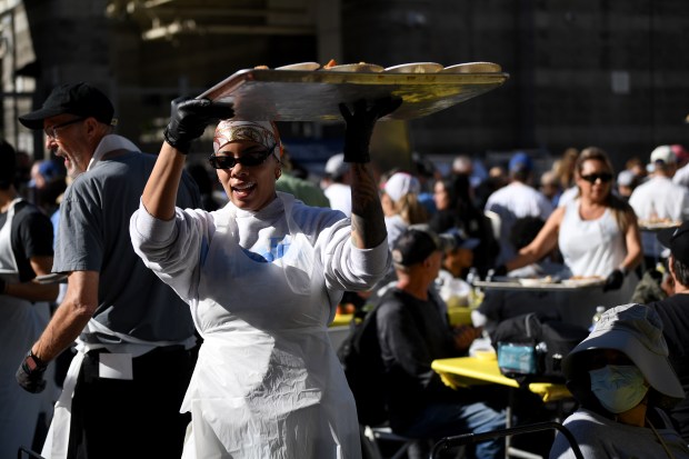 Monet Barron helps serve food during the annual Los Angeles...
