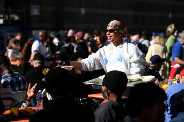 Monet Barron helps serve food during the annual Los Angeles...
