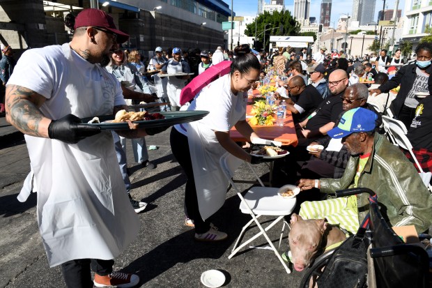 Lorena Cardenas and David Murillo, volunteers with Bank of America,...