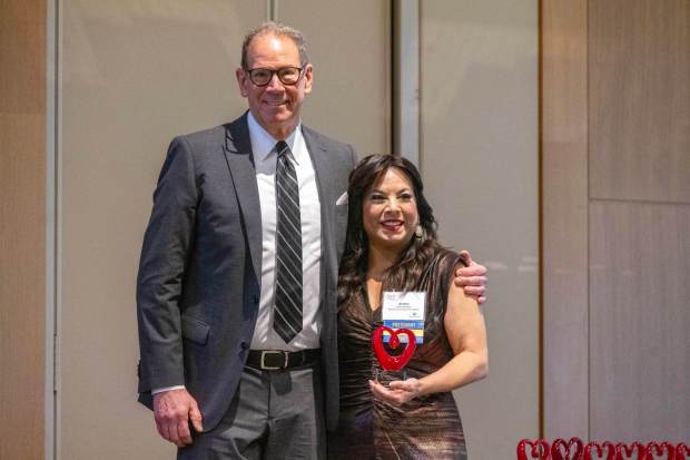 AFP-Greater Los Angeles Chapter President Andrea Salazar presents VP of Philanthropy Union Rescue Mission Richard Newcomb with the award for Outstanding Fundraising Professional during the National Philanthropy Day luncheon at the Huntington Library, Art Museum, and Botanical Gardens in San Marino on Friday, Nov. 14, 2025. (Photo by Hans Gutknecht, Los Angeles Daily News/SCNG)