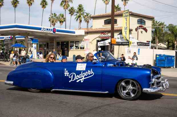 Korean War Veteran Sam Lopez is driven in a LA...
