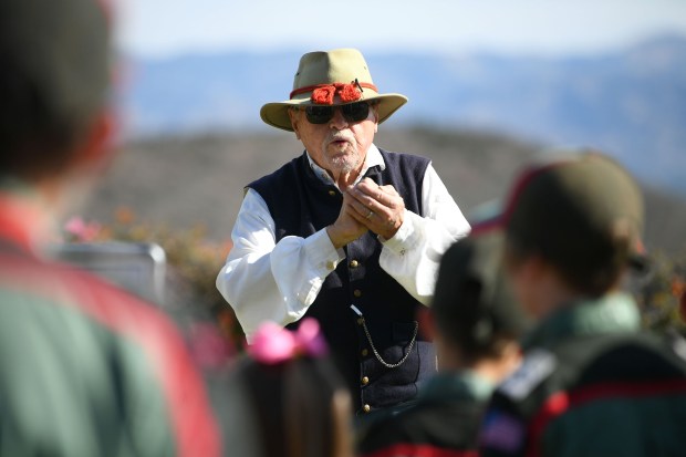 Civil War reenactor Doug Carroll talks to visitors during the...