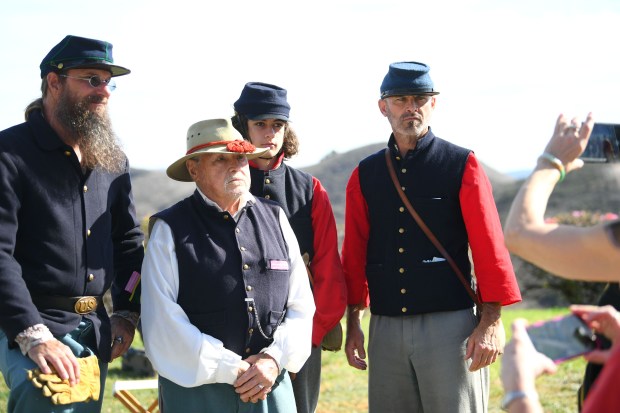 Civil War reenactors pose for a photo during the annual...