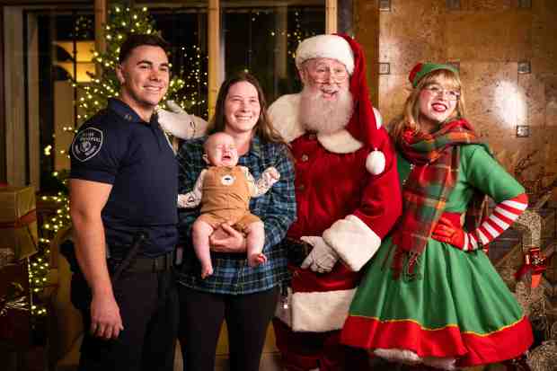 The Fyfe family, of Long Beach, get a photo with...