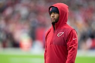 Arizona Cardinals quarterback Kyler Murray looks on before an NFL football game against the...