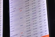 Some flights are seen cancelled on the electronic board in terminal C, on Friday, Nov. 7,...