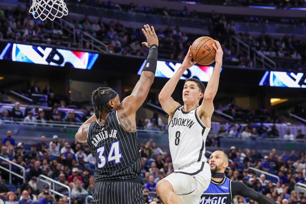Brooklyn Nets guard Egor Demin (8) goes to the basket against Orlando Magic center Wendell Carter Jr. (34) during the first quarter at Kia Center. 