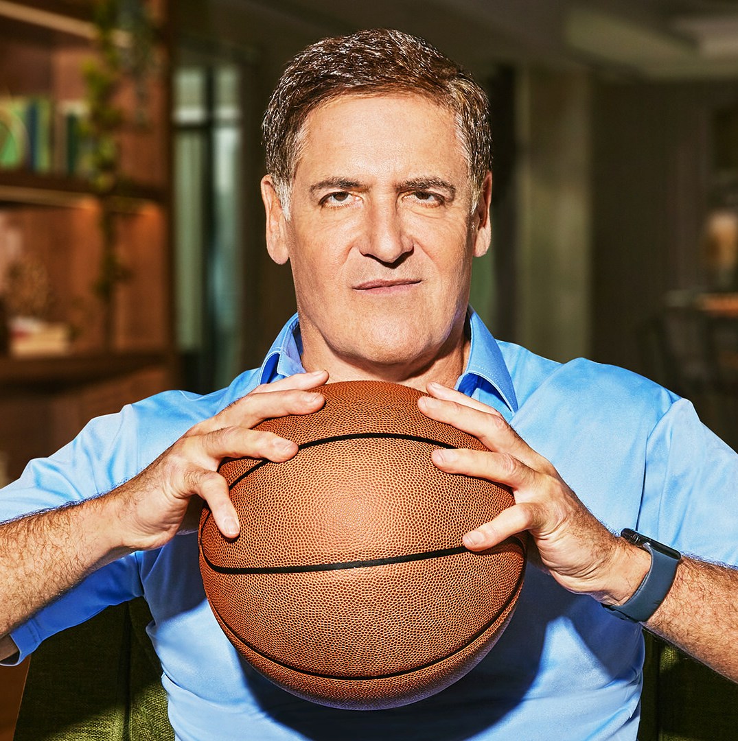 Mark Cuban holding a basketball.