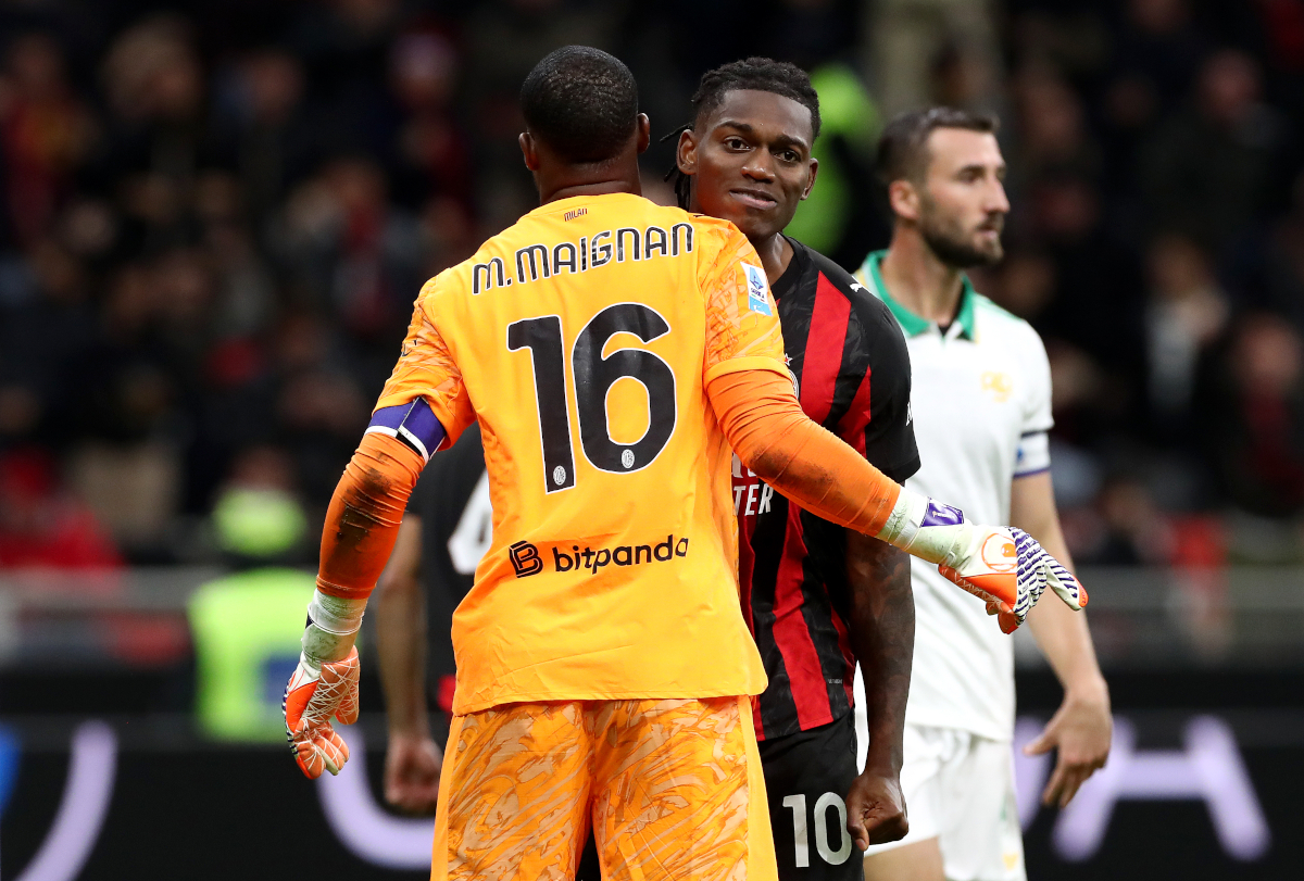MILAN, ITALY - NOVEMBER 02: Mike Maignan of AC Milan celebrates with teammate Rafael Leao after saving a penalty kick from Paulo Dybala of AS Roma (not pictured) during the Serie A match between AC Milan and AS Roma at Giuseppe Meazza Stadium on November 02, 2025 in Milan, Italy. (Photo by Marco Luzzani/Getty Images)