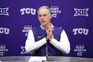 FILE - TCU head coach Jamie Dixon responds to questions during a post game news conference...