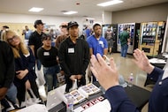 Kaleb Snodgrass of Opifex-Synergy talks with students at Texas State Technical College...