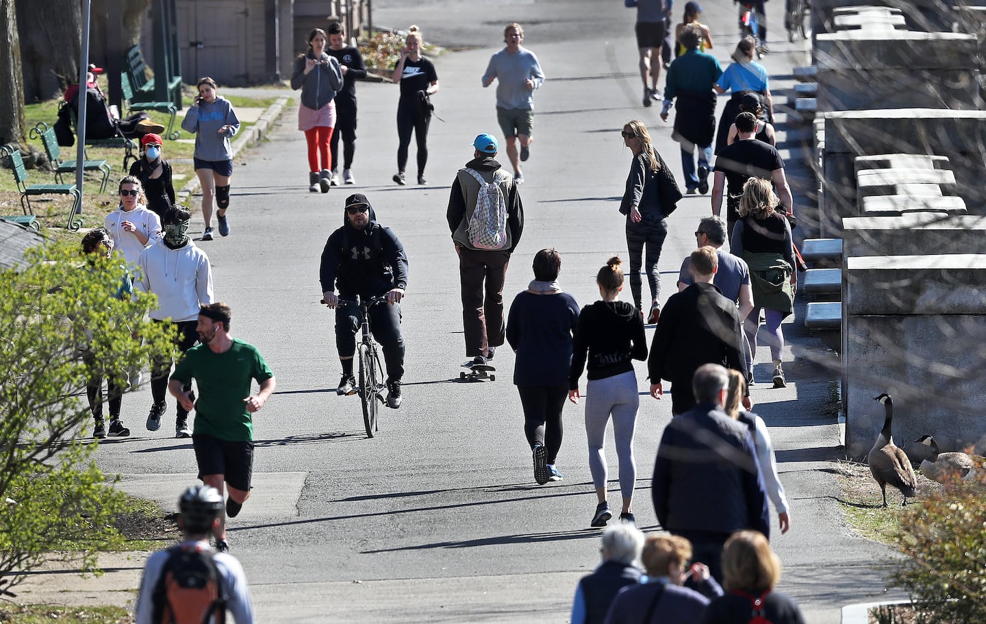 Runners, walkers, and cyclists on the Esplanade along the Charles River on April 6, 2020.