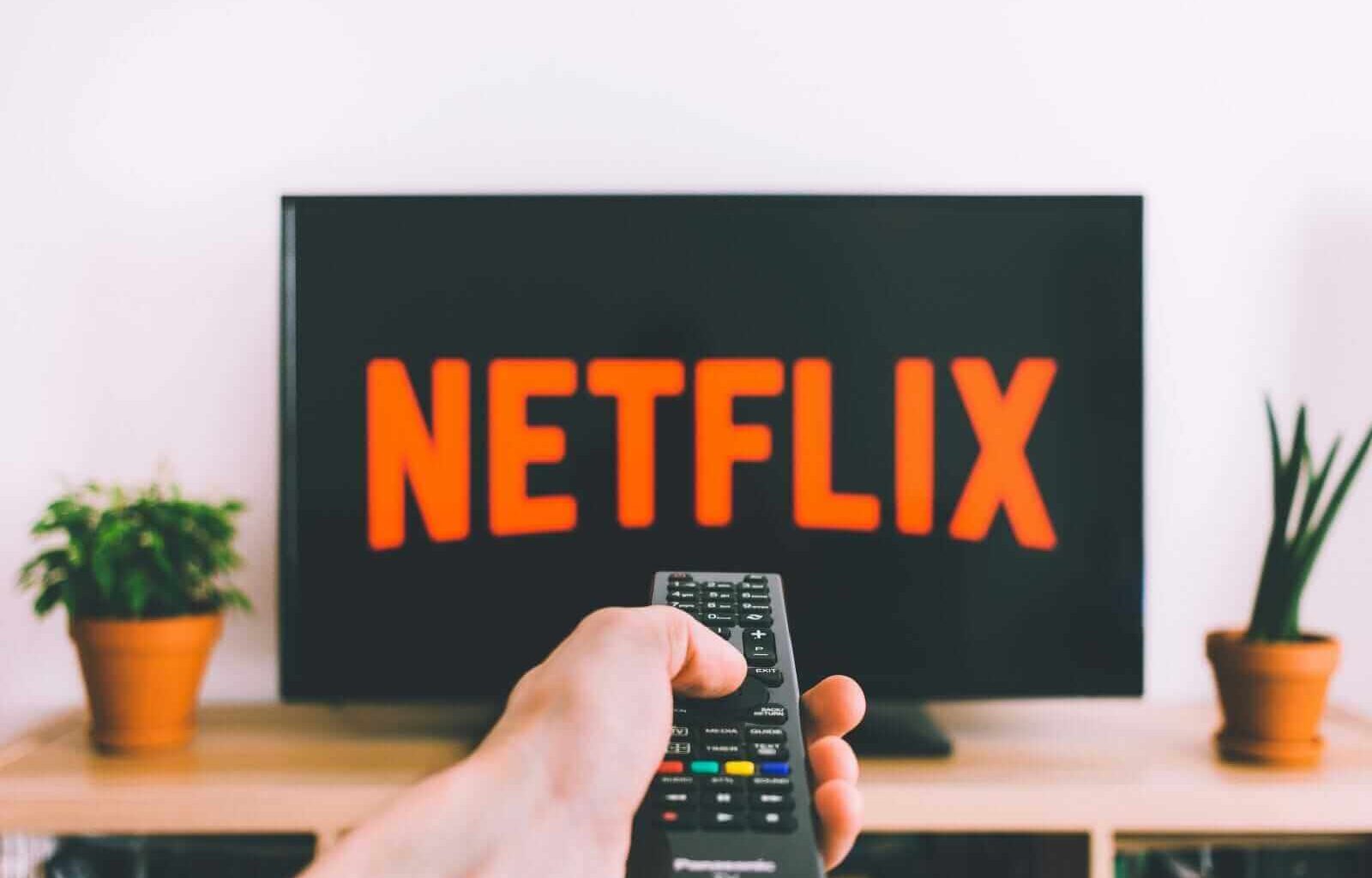 Netflix on tv with remote by freestocks via Unsplash