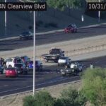 Northbound Loop 303 near Clearview Blvd: A crash and debris are blocking the center and right lanes.