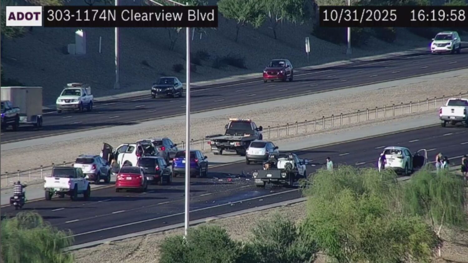 Northbound Loop 303 near Clearview Blvd: A crash and debris are blocking the center and right lanes...
