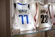 A Luka Dončić game-worn Dallas Mavericks rookie jersey and LeBron James game-worn jersey on...