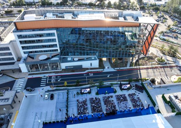 A ceremonial ribbon cutting event for the opening of City...