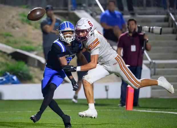 El Modena’s Isaac Perez, right, breaks up a pass intended...