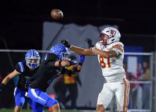 El Modena tight end Sean De la Riva, right, can’t...