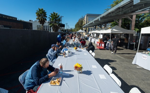 Event goers eating lunch during USHS Adult Center’s Thanksgiving event...