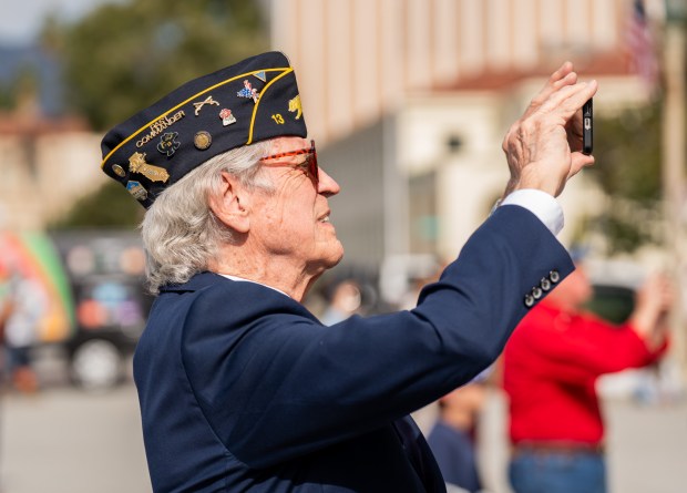 Eagle Linker takes a video during the Veterans Day Ceremony...