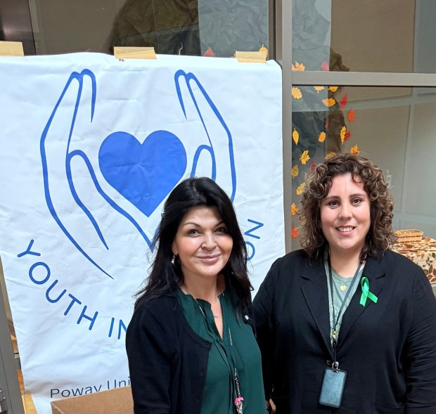 Mercedes Hubschmitt, homeless liaison and director of the Poway Unified School District's Support Services, left, and Laura Upson, Youth in Transition coordinator, provide workshop support throughout the year to help district teachers and staff identify students in need. (Courtesy Youth in Transition)