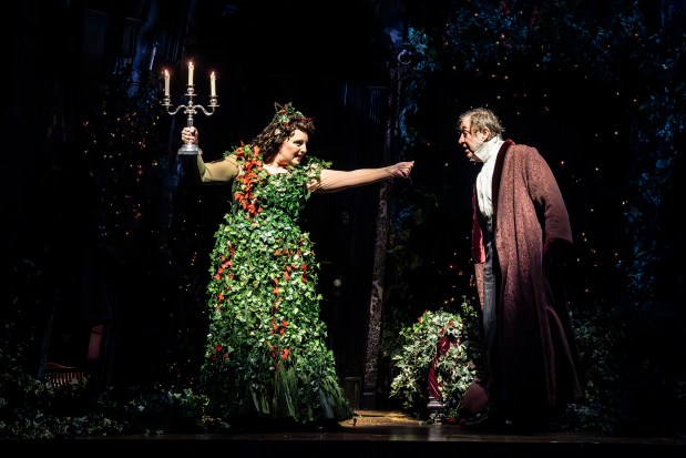 Bri Sudia is the holly-covered Ghost of Christmas Present opposite Christopher Donahue in his first turn as Ebenezer Scrooge in the Goodman Theatre's "A Christmas Carol" in December 2024. (Liz Lauren)