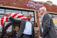 Dallas Mayor Eric Johnson shows Wells Fargo CEO Charlie Scharf the area before entering the...