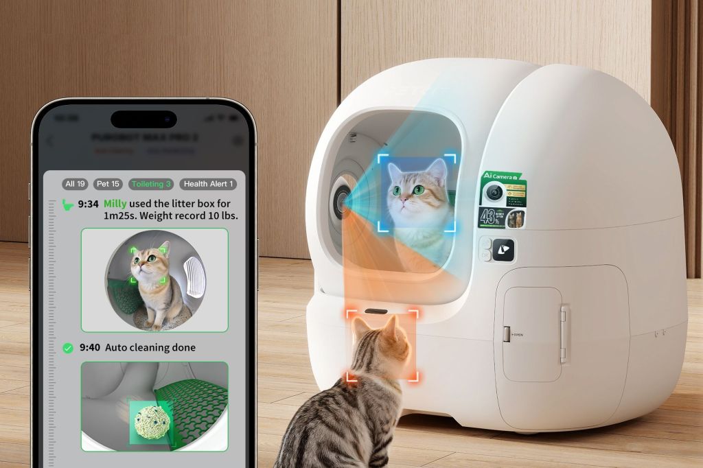 A smartphone displaying an app with pet toileting data next to an AI-powered smart litter box with a cat looking at it.