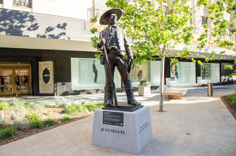 Statues of historical figures, including Juan Sequin, feature in the Alamo Promenade.