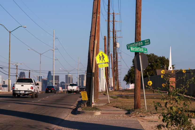 Cars drives down Singleton Boulevard as downtown Dallas is seen on Friday, Nov. 14, 2025, in...