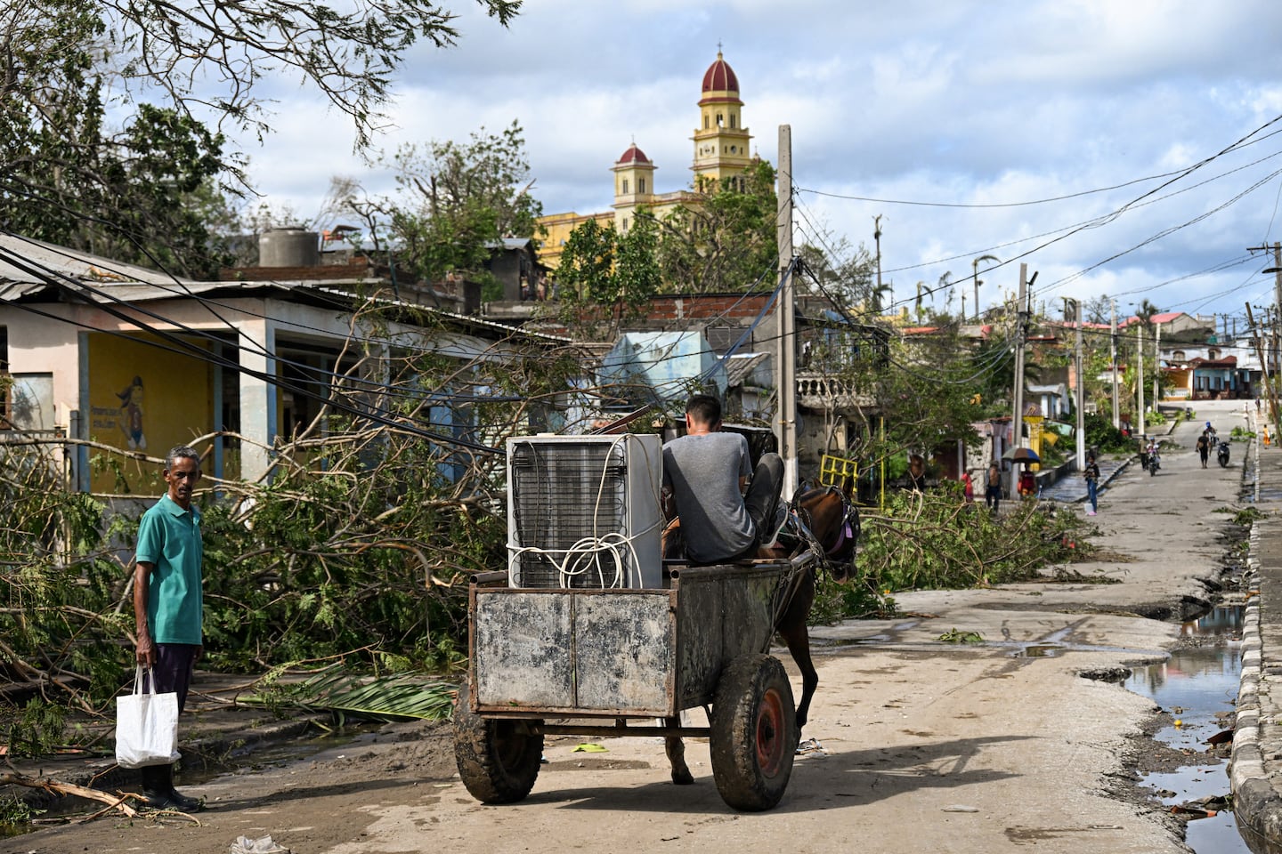 Residents in El Cobre, Santiago de Cuba province, Cuba, recovered their belongings on Thursday after Hurricane Melissa passed.