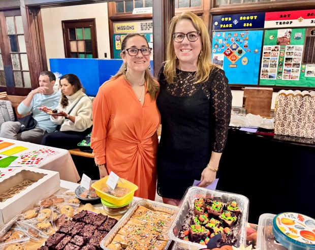 Jessica Tull, left, and Ashley Weaver tended to a table...