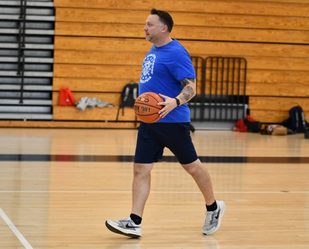 Community Relations Officer Damian Caggiano checks out the defense as...