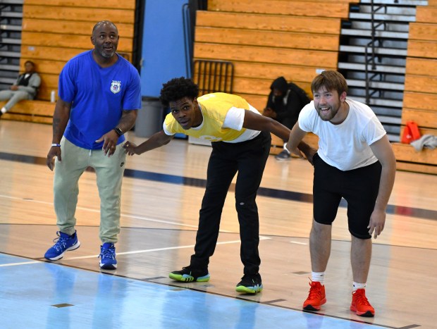 Inspector Jarreau Thomas, left, RHS’s Zaid McDonald and volunteer Ben...