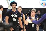TCU forward David Punch (15) and guard Brock Harding (2) celebrate after their team defeated...