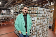 Ryan Bandy, chief business officer at Indeed Brewing in Minneapolis, stands near a pallet of...