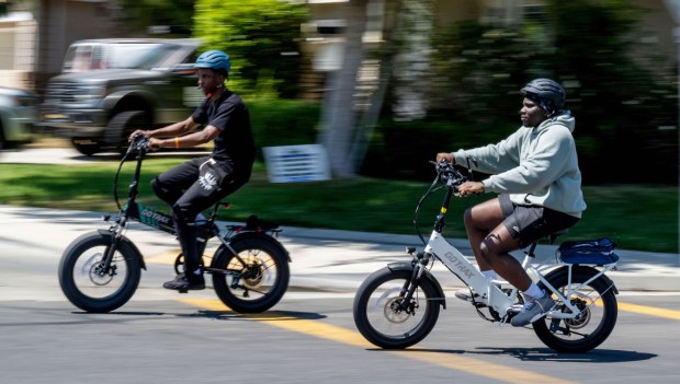 E-bike riders travel in Eastvale in Riverside County in 2024. (Terry Pierson / The Press-Enterprise)