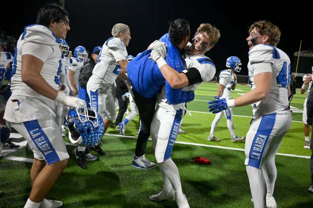 La Habra’s Malcolm Roberts spins a coach in the air...