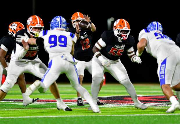 San Jacinto’s Josue Estrada grabs the snap while playing against...