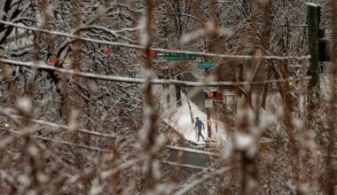 Early morning runner along Kelly Drive and Water Works Drive after an overnight snow fall, Philadelphia, Wednesday morning Feb. 12, 2025.