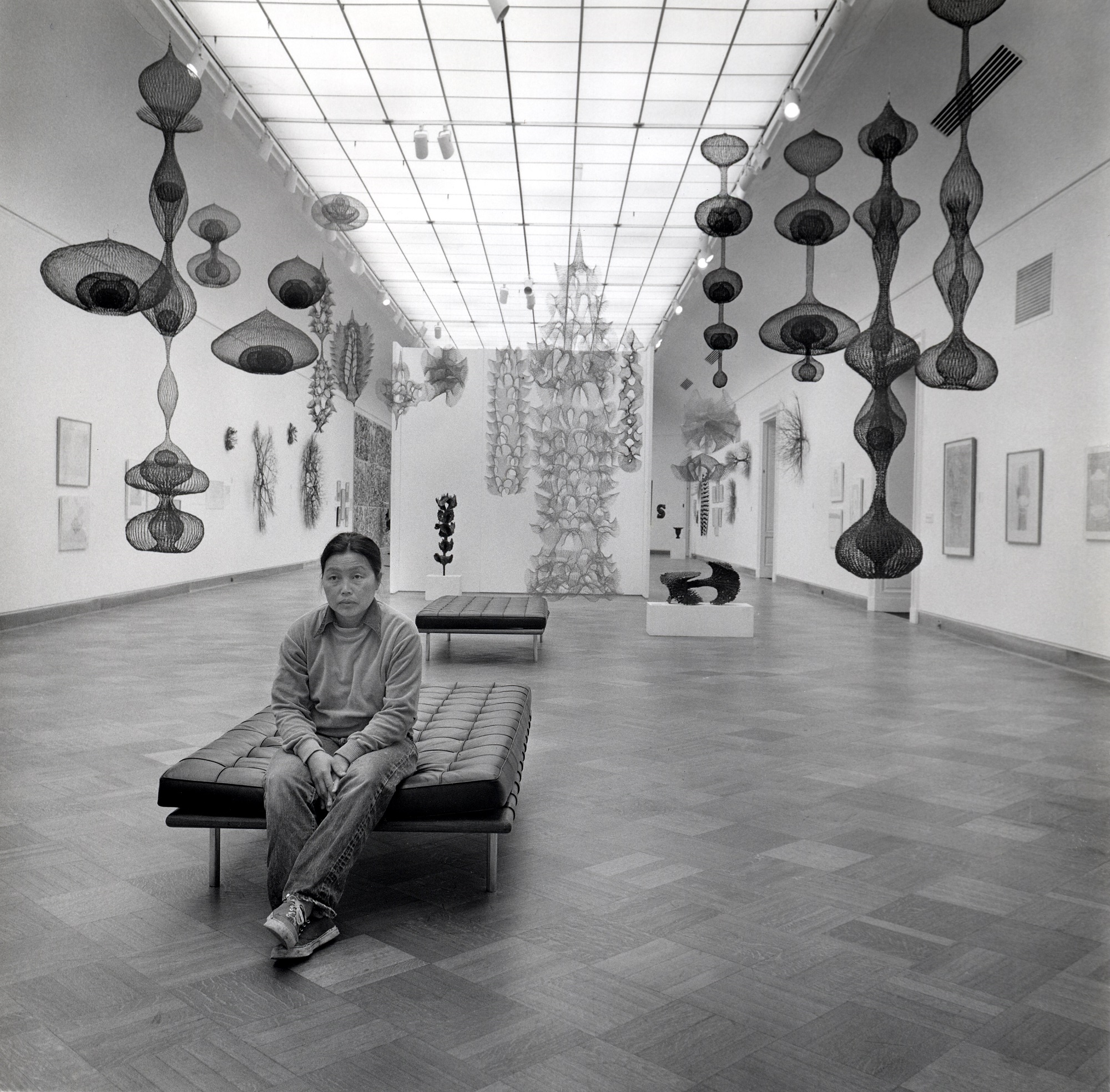 Ruth Asawa at “Ruth Asawa: A Retrospective View,” San Francisco Museum of Art, 1973. Photograph by Laurence Cuneo.