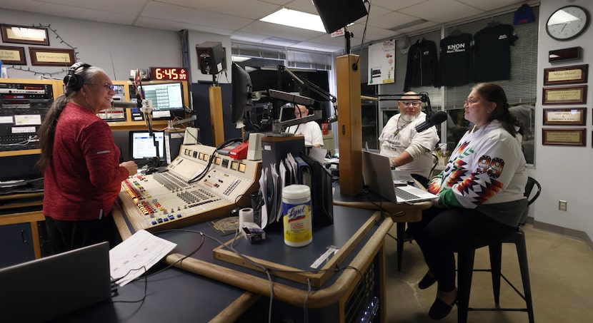 Albert Old Crow, left, listens to the details of a community update as shared by Jessica...