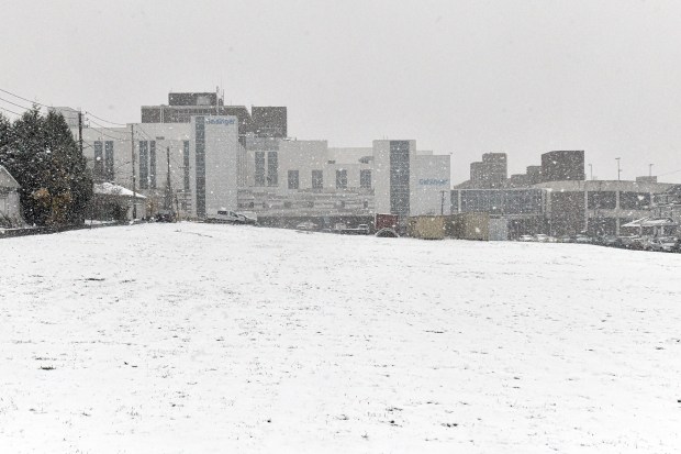 An empty lot sits across the street from the Geisinger...