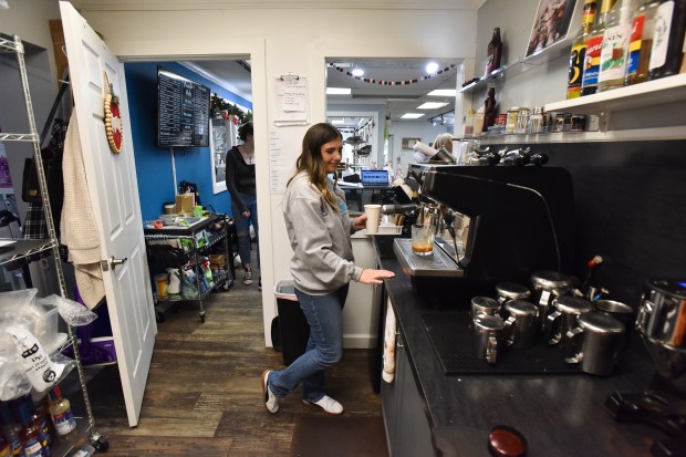 Owner of Purrfect Mugs Cat Cafe Vikki Kenyon makes a...