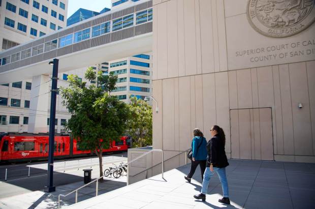 In the blue coat former Chula Vista Councilmember Andrea Cardenas walking out of Superior Court in Downtown on Wednesday, Aug. 28, 2024 in San Diego, California. (Alejandro Tamayo / The San Diego Union-Tribune)