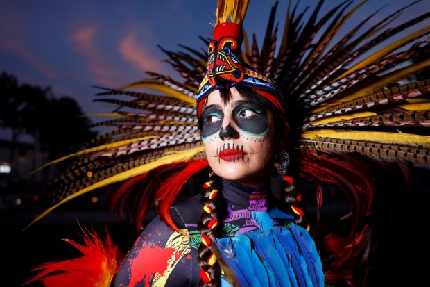 Michelle Luna Reynoso of Danza Azteca Kuauhkoatl participated in the Centro Cultural de la Raza's Día de Muertos procession on Nov. 2, 2025 in San Diego, CA. (K.C. Alfred / The San Diego Union-Tribune)