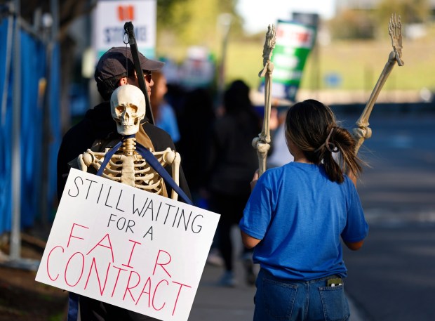 San Diego, CA - November 26: RNs Kyle Casipit and wife Narisa were among the over 5,700 Sharp Health Care nurses that participated in a three-day strike on November 26, 2025 in San Diego, CA. (K.C. Alfred / The San Diego Union-Tribune)